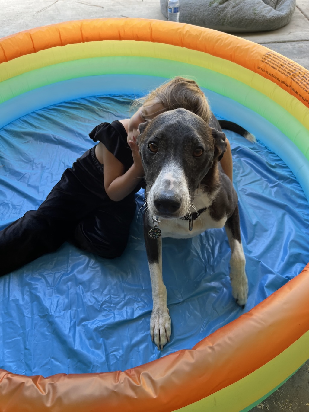 zu with wally in a kiddie pool